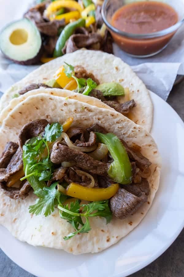 This beef fajita recipe is a one pan easy to make recipe with lots of flavor and served in a delicious tortilla! Dinner couldn’t get any better! #atablefullofjoy #taco # tacotuesday #cincodemayo #easydinner #onepan