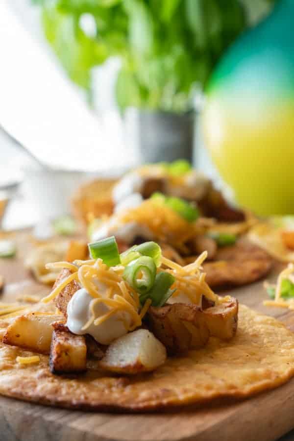 Potato Tacos, A simple and delicious potato taco recipe. Easy to make with only 2 required ingredients, a few spices, and then your favorite toppings! #atablefullofjoy #vegan #vegetarian #potatotacos #tacotuesday #cincodemayo #potato