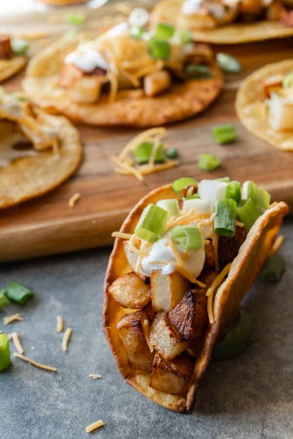 Potato Tacos, A simple and delicious potato taco recipe. Easy to make with only 2 required ingredients, a few spices, and then your favorite toppings! #atablefullofjoy #vegan #vegetarian #potatotacos #tacotuesday #cincodemayo #potato