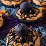 Spider Cookies, These spider cookies are super fun to make and really tasty! A chocolate sugar cookie topped with delicious buttercream and a lindor truffle spider! YUM! #atablefullofjoy #halloween #sugarcookie #spider #cookie #monster #party #kidcrafts