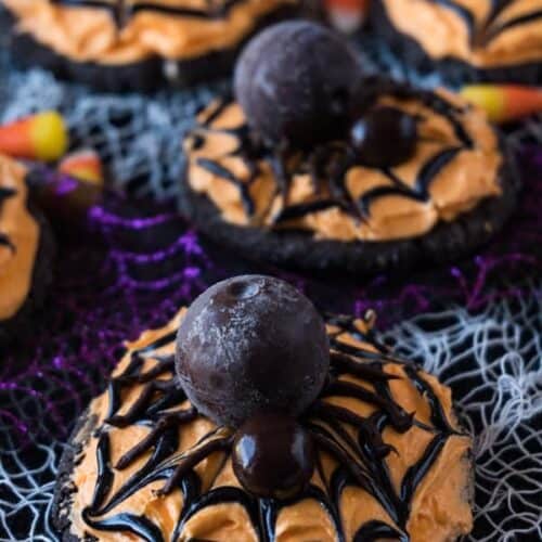Spider Cookies, These spider cookies are super fun to make and really tasty! A chocolate sugar cookie topped with delicious buttercream and a lindor truffle spider! YUM! #atablefullofjoy #halloween #sugarcookie #spider #cookie #monster #party #kidcrafts