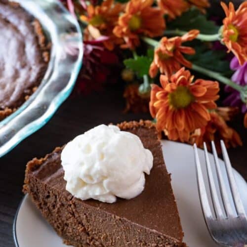 This chocolate pumpkin pie is an easy spin on the classic pumpkin pie. Rich and chocolaty- you can’t go wrong! #atablefullofjoy #chocolate #chocolatepie #chocolatepumpkinpie #pie #pumpkinpie #thanksgiving