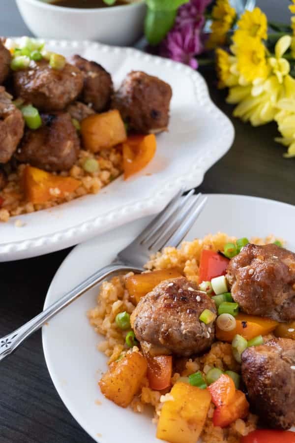 Sweet and Sour Meat Balls, a delicious meatball recipe that will have you making these over and over again! Dairy, Soy, and Gluten free you won’t want to miss this tasty healthy dinner! #meatballs #paleo #paleomeatballs #sweetandsour #glutenfree #dairyfree #soyfree #dinner #atablefullofjoy #asian #pork #baked