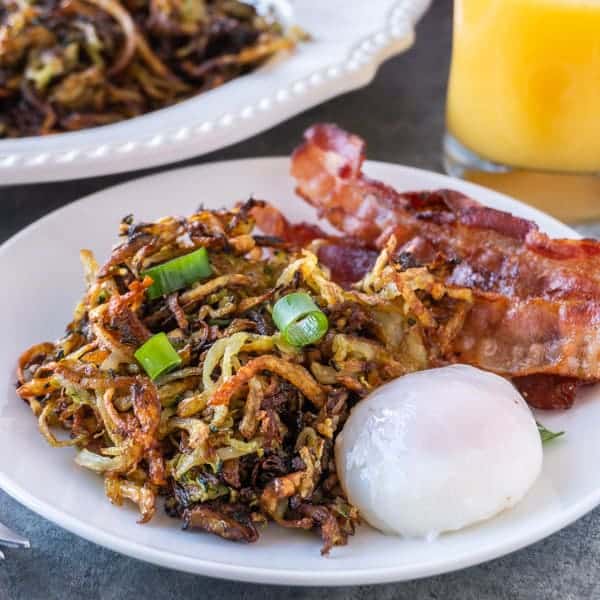 Zucchini Hash Browns are the perfect way to get some veggies in while still enjoying a favorite breakfast treat!  These zucchini hash browns are so tasty you won’t even know there is zucchini in them! #healthy # veggie #hash brown #zucchini #forkids #glutenfree #atablefullofjoy #crispy #tasty #vegan #lowcarb