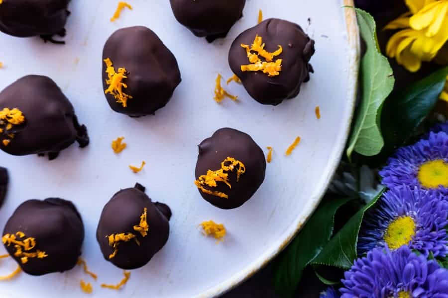 Vegan Truffles,These creamy orange vegan truffles are a delicious treat that are dairy free, bursting with delicious orange flavor, and the perfect sweetness. #truffle #cashewcream #dairyfree #df #gf #glutenfree #paleo #cashew #orange #atablefullofjoy #orangecream #maplesyrup #chocolate #raw #healthy