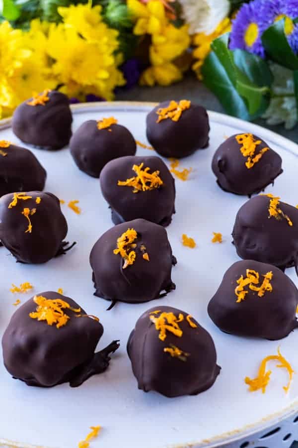 Vegan Truffles,These creamy orange vegan truffles are a delicious treat that are dairy free, bursting with delicious orange flavor, and the perfect sweetness. #truffle #cashewcream #dairyfree #df #gf #glutenfree #paleo #cashew #orange #atablefullofjoy #orangecream #maplesyrup #chocolate #raw #healthy