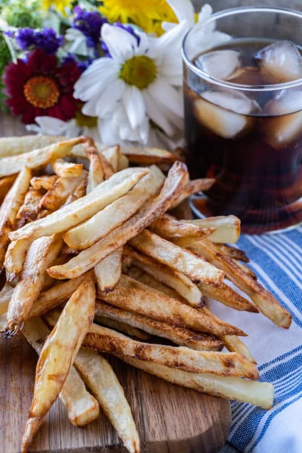 Homemade Baked French Fries, easy to make and deliciously crunchy! #homemade #frenchfries #intheoven #ovenbaked #baked #crispy @atablefullofjoy #recipe #easy