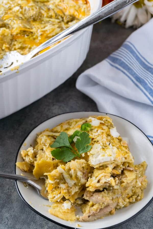 Shredded Chicken Enchiladas, a delicious and easy dinner that can be made in no time! #enchiladas #chicken #rotisserie #atablefullofjoy #leftover #easy #green #corntortillas #cassserole