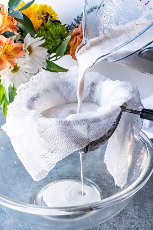 Almond Milk Being Strained