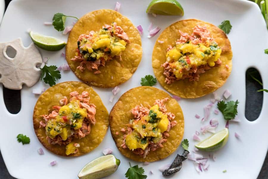 Top down view of salmon mango tacos