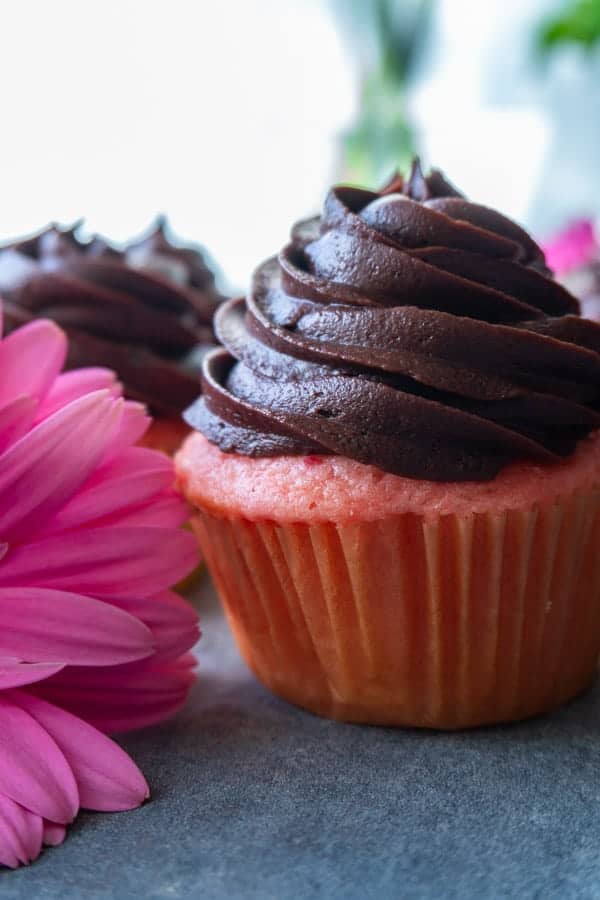 Chocolate buttercream on strawberry cupcake