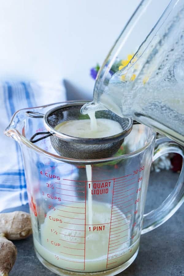 Ginger juice being strained