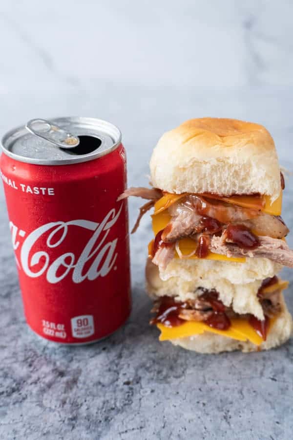Coca-Cola Pulled Pork Sandwich next to can of open coke